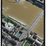 A 3D map in the Maps app, showing details of a city.
