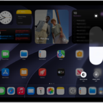 The iPad Home Screen with Dark Mode on.