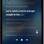 The Now Playing screen showing the Apple Music Sing slider to the right of the lyrics. The currently playing lyrics are highlighted.