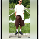 The Edit screen with a photo in the center. At the bottom of the screen, from left to right, are the Portrait, Adjust, Filters, Crop, and Clean Up buttons. The Crop button is selected and there is a slider to adjust the geometry enhancements.