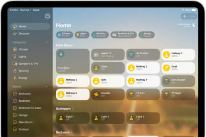 The Home app with the sidebar on the left, showing Home, Automation, and Discover tabs near the top left. Categories and Rooms in the home appear below. To the right of the sidebar, at the top, are the Intercom, Add, and More Options buttons. Category buttons appear near the top. Below that are scenes, camera images, and a room with its accessories.