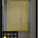The Magnifier app is open and a door is being detected. A description shows how far away the door is.