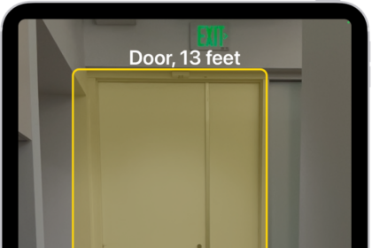 The Magnifier app is open and a door is being detected. A description shows how far away the door is.