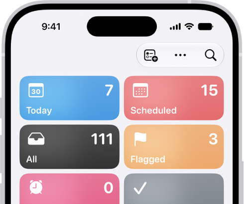 A Reminders screen showing a grid of Smart Lists, such as Today, Scheduled, and Flagged, each showing the number of items. Under the heading 'My Lists,' shows a list of custom reminder categories like Family, Work, and Camping Trip.