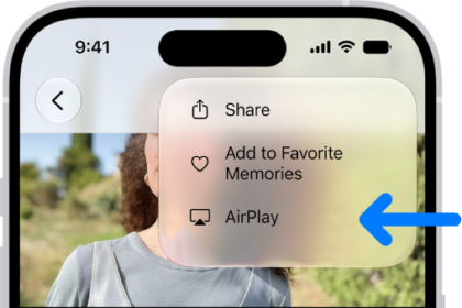 A slideshow in the Photos app plays on the iPhone. At the top right of the screen is a pop-up menu, with an option to choose AirPlay.
