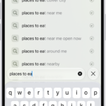 A Safari search screen, with the onscreen keyboard at the bottom of the screen. Above the keyboard, the search field contains text, and related search suggestions are listed above.
