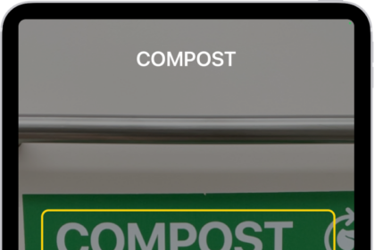 The Magnifier app detecting a finger pointing at text on a sign.