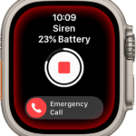 Siren counting down. Near the top is the battery charge, in the middle is a Play button, and at the bottom is the Emergency Call slider.