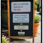 The Camera tab, showing a restaurant menu translated from English to Spanish.