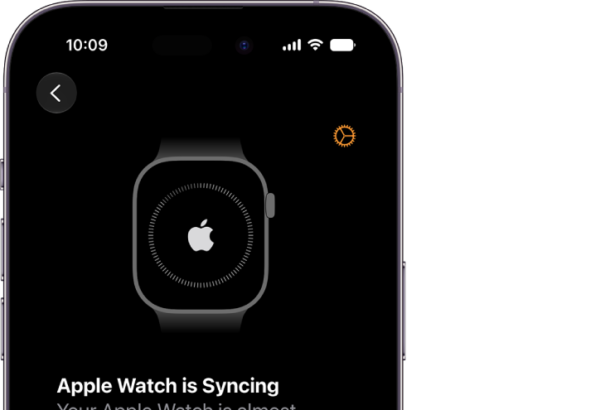 An iPhone and Apple Watch showing their syncing screens.