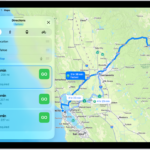 An iPad showing a map with several driving route options to the same destination. Each route shows the estimated time and distance, and a Steps button to see detailed directions. Color coding on each route indicates traffic conditions.