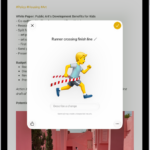 The Genmoji window showing a created Genmoji of a man running across a finish line