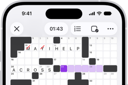 A partially filled crossword puzzle, with controls above it, and a keyboard open at the bottom.