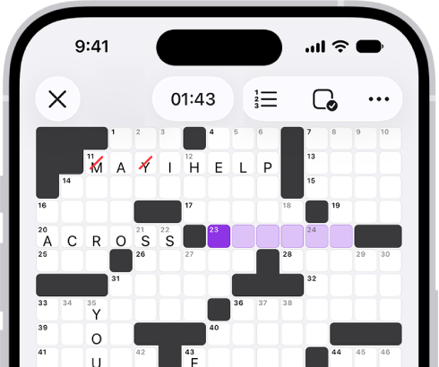 A partially filled crossword puzzle, with controls above it, and a keyboard open at the bottom.